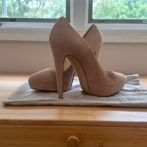 Brian Atwood suede hidden platform pumps.
